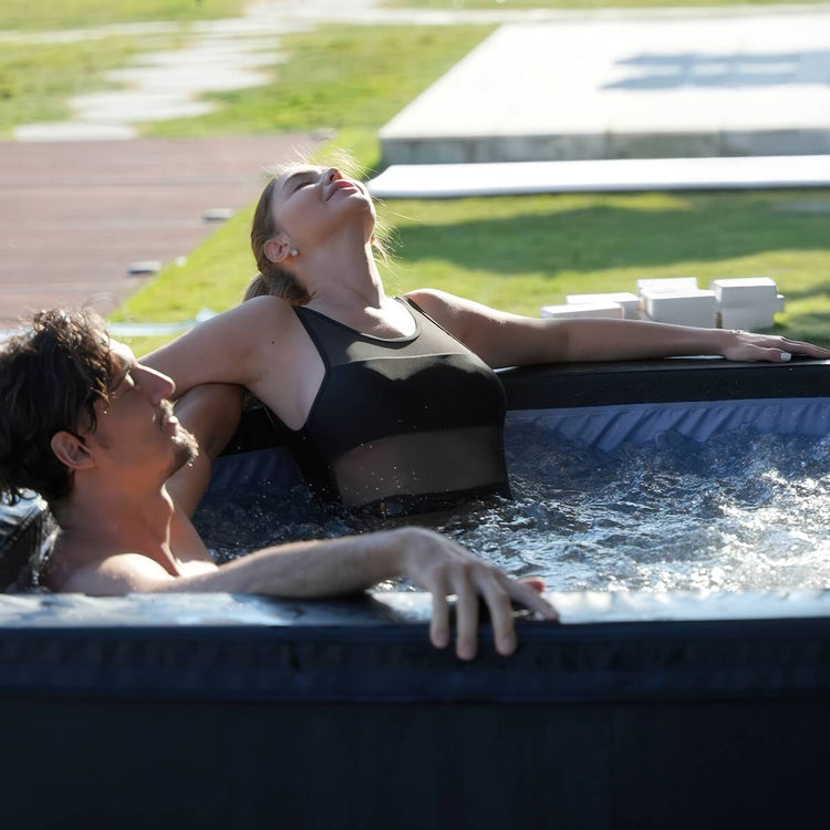Couple relaxing in hot tub outside.